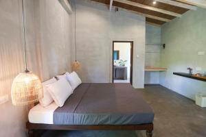 Postel nebo postele na pokoji v ubytování Canaya Boutique Villa + 49 fotografií