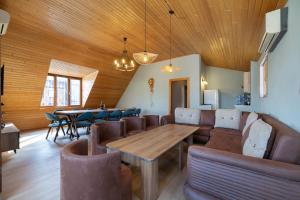 a dining room with a table and chairs at Apartments with wine cellar in Old Tbilisi in Tbilisi City