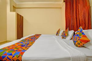 Postel nebo postele na pokoji v ubytování FabHotel 4 Pillar + 16 fotografií