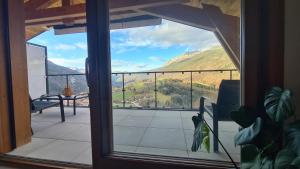 a balcony with a view of a mountain view at Le Balcon des Aiguilles - vue montagne - AravisTour in Saint-Jean-de-Sixt
