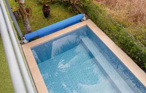 an overhead view of a swimming pool in a yard at Canto da Manu Panoramic in Calheta