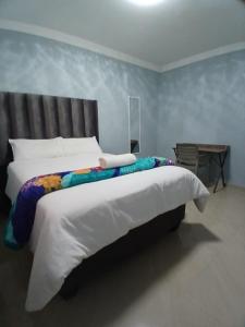 Postel nebo postele na pokoji v ubytování The Cozy Nest