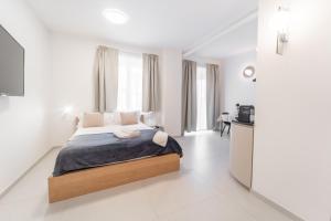 Postel nebo postele na pokoji v ubytování Magai