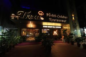 a theater with a neon sign at night at karisma premium in Bhubaneshwar