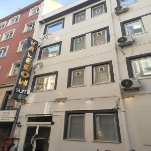 a building with a sign on the side of it at Valeron Suit Premium in Istanbul
