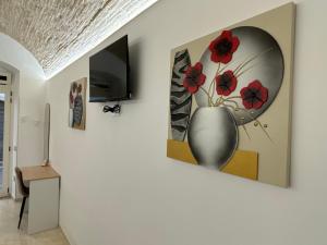 TV a/nebo společenská místnost v ubytování B&B Il Catepano