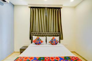 Postel nebo postele na pokoji v ubytování FabHotel Wild Wings Narsingi + 22 fotografií