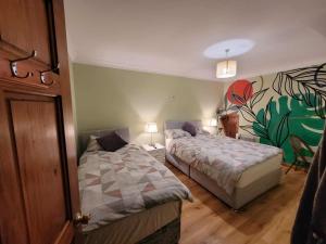 Ένα ή περισσότερα κρεβάτια σε δωμάτιο στο Stay With Jack