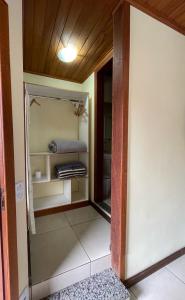 an open door to a room with a closet at Pousada Guimaraes in São Pedro da Serra