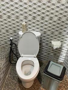 a bathroom with a toilet with a box on top of it at Ocean View Sunset Heaven in Nusa Penida +105 photos