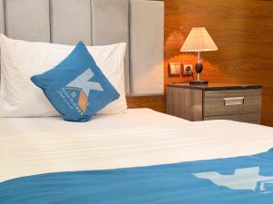 Ένα ή περισσότερα κρεβάτια σε δωμάτιο στο Khyber Hotel