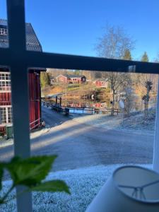 a view of a farm from a window at Sweet guest house with a view in Sävsjö