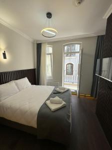 Ένα ή περισσότερα κρεβάτια σε δωμάτιο στο Nine Rooms by taksim