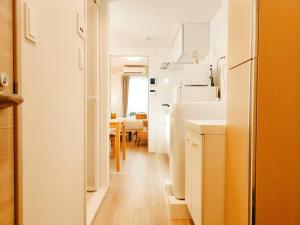 a hallway with a kitchen and a dining room at Minami Ikebukuro APT Dear Cosmo Ikebukuro subway 6mins in Tokyo
