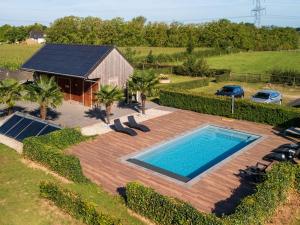 an overhead view of a swimming pool and a house at Hof van Kooij in Groessen