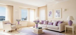 een woonkamer met een witte bank en paarse kussens bij Lilac Apart 1 Antalya in Antalya