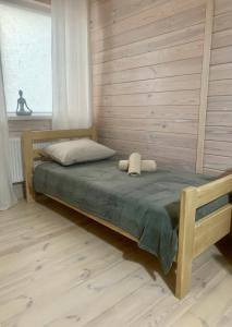 a bedroom with a bed with two towels on it at Еко апартаменти DOM Art in Ovruch