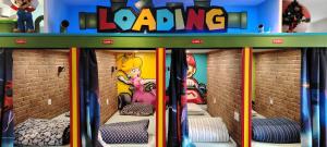a lego house with three bunk beds in it at Maison game in Villeneuve-sous-Dammartin