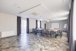 a conference room with a table and chairs at Jurajski Kryształ in Zaborze +144 photos