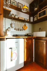 a kitchen with a white refrigerator in a kitchen at Casa di Lucy Spello in Spello