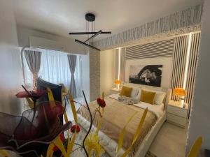 a bedroom with a bed and a large window at Apartament Nedianu in Craiova