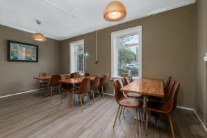 a dining room with wooden tables and chairs at Old Town Reykjavik in Reykjavík