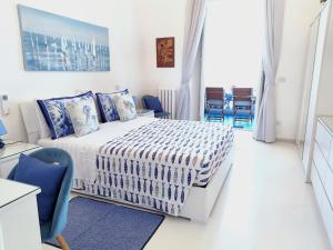 Ένα ή περισσότερα κρεβάτια σε δωμάτιο στο De Luxe La Terrazza