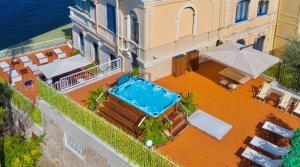an aerial view of a building with a swimming pool at La Terrazza De Luxe in Sorrento