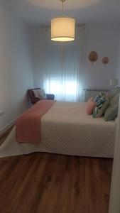a bedroom with a large bed in a room at Nordés in Vilagarcia de Arousa +51 photos