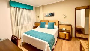 Ένα ή περισσότερα κρεβάτια σε δωμάτιο στο Hotel Spa Galatea