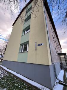 a building with a sign on the side of it at Уютная квартира в 10 минутах от моря in Aseri