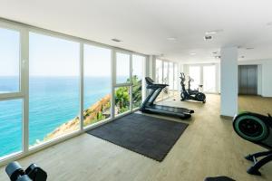 a gym with a view of the ocean at Breathtaking Bay views Nerja in Torrox