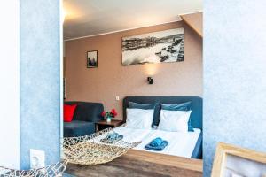 En eller flere senge i et værelse på Central stylish apartment with shared rooftop terrace and jacuzzi MK2