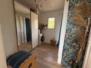 a hallway of a house with a room with a mirror at vue sur le golfe de Saint Florent in Saint-Florent