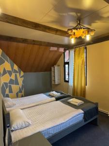 Ένα ή περισσότερα κρεβάτια σε δωμάτιο στο Paxlava Dilijan Guesthouse & Restaurant