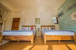 Letto o letti in una camera di Sabai B&B 澎湖船家寶民宿