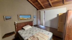 Ένα ή περισσότερα κρεβάτια σε δωμάτιο στο Cabañas SKY