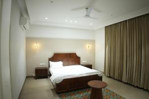 Postel nebo postele na pokoji v ubytování Kaayanaat Villa