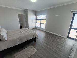 Postel nebo postele na pokoji v ubytování The Lion's Crest