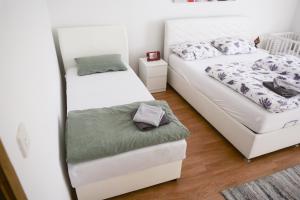 Ένα ή περισσότερα κρεβάτια σε δωμάτιο στο Apartman Vion - City View +37 φωτογραφίες