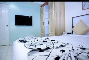 TV a/nebo společenská místnost v ubytování Miugu Village Hotel