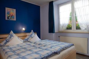 Postel nebo postele na pokoji v ubytování Fewo Dahlie + 3 fotografie