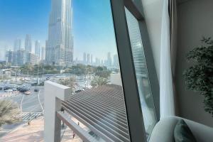 a balcony with a view of a city skyline at Luxurious 3 BR with Burj Khalifa View in Downtown in Dubai