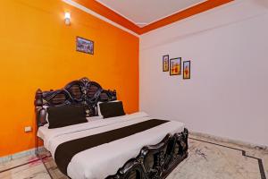 Ένα ή περισσότερα κρεβάτια σε δωμάτιο στο Hotel O Drip Stay Inn +27 φωτογραφίες