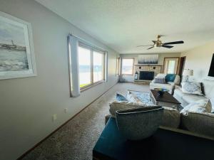 a living room with a couch and a ceiling fan at 600 Lakeshore home in Lake City