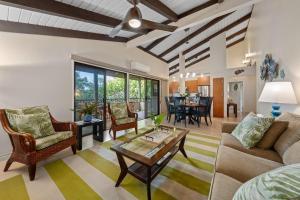 a living room with a couch and a table at Wailea Ekolu 1604 · WE 1604 Wailea 2BD Condo w AC Pool Near Beac in Kihei