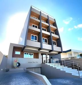 a building with stairs in front of it at Flat 201 Paradise in João Pessoa