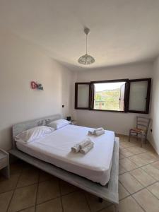 Ένα ή περισσότερα κρεβάτια σε δωμάτιο στο Villa Su Navru +101 φωτογραφίες