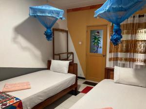 Кровать или кровати в номере Aran Villa Yala