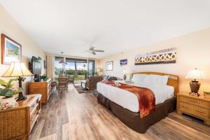 a hotel room with a bed and a living room at Eldorado A108 in Kaanapali +62 photos